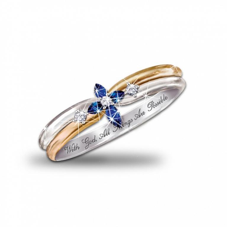 Un tradizionale topazio blu rotondo brilla in questo anello di fidanzamento in oro bianco 18 carati